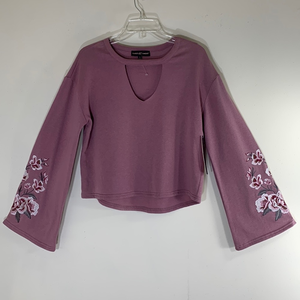 NWT. Almost Famous Floral Embroidered Sleeve Sweatshirt Women’s Large.